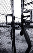 rusty lock and chain on old bent gate