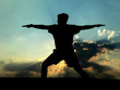 silhouette of man practicing yoga silhouette of man practicing yoga