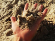 hand holding sand on a beach hand holding sand on a beach