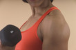 detail of woman lifting weights
