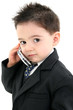  adorable baby boy in suit on cellphone