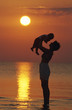mother and child on the sea beach