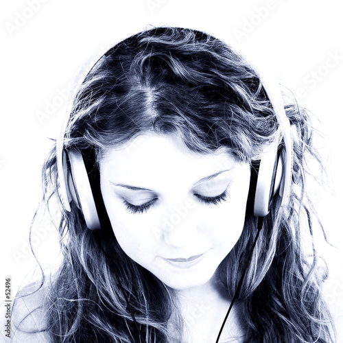 beautiful teen girl listening to headphones