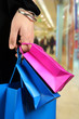 carrying shopping bags in shopping centre