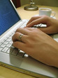man's hands typing at laptop keyboard man's hands typing at laptop keyboard