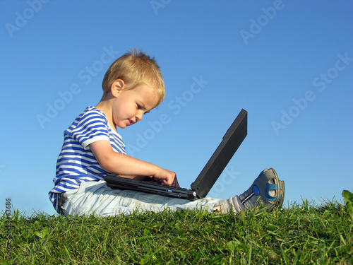 Photo: child with notebook sit blue sky child with notebook sit blue sky