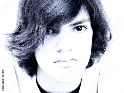 close up of teen boy in blue tones