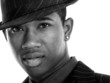 attractive young man in pin striped suit and hat