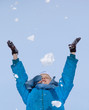 young girl playing with snow