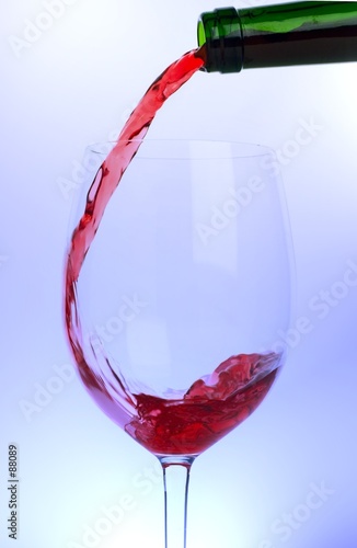 wine being poured - backlit with colored lighting