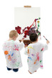 two toddler boys painting at easel