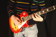 playing a chord on an electric guitar