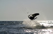 kite boarder jumping on the ocean