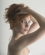sexy red head preparing for a shower