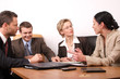 Group Of People Negotiate At T...