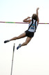 athlete clearing the bar