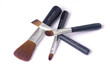 four beauty brushes