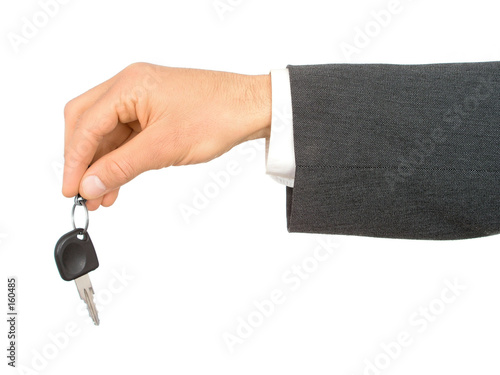 businessman's hand holding car key