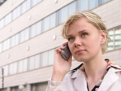 Photo: businesswoman using a mobile phone businesswoman using a mobile phone