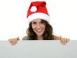 Photo: girl wearing christmas hat holding white card girl wearing christmas hat holding white card