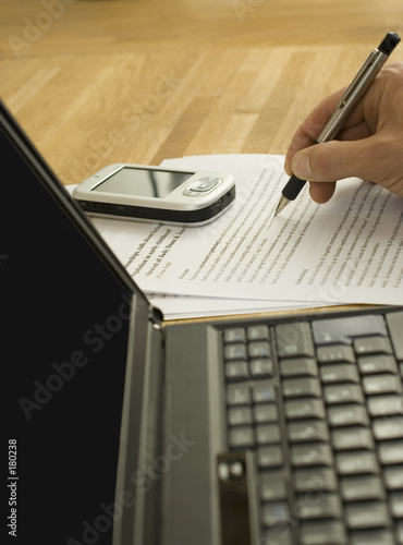 business man writing on laptop