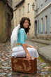 angel with a suitecase