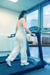 beautiful woman running on treadmill