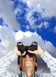 business man with binoculars over sky business man with binoculars over sky