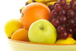 bowl of fresh mixed fruit, backlit.