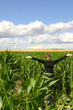 a teenage girl in a cornfield
