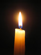 candle against dark background