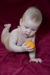 newborn baby and  fruit