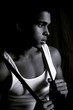 attractive young man in tank top and suspenders