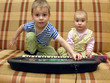 child and baby play