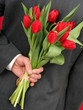 man holding flowers