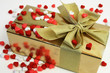 wrapped gift surrounded with heart shaped candies