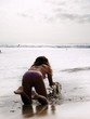 girl playing on the beach