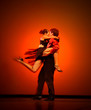classical dancers on red background