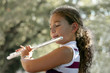 Foto: girl playing a flute girl playing a flute