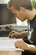 young man studying in front of his computer