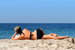 woman reading on the beach