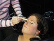 waxing her eyebrows