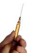 hand holding syringe with drop at end of needle 1 hand holding syringe with drop at end of needle 1