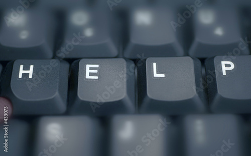 help - spelled in keys on a laptop
