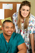 doctor and nurse smiling