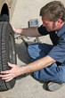mechanic removing tire