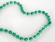 green mardi gras bead
