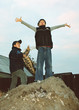 two boys make a  fire