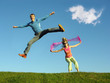 couple jump under cloud