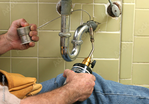 plumber welding pipe